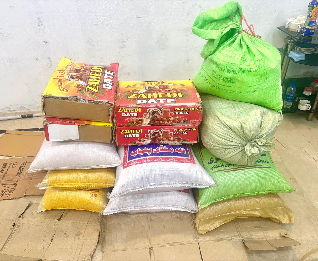 Food support supplies including flour bags, rice and dates