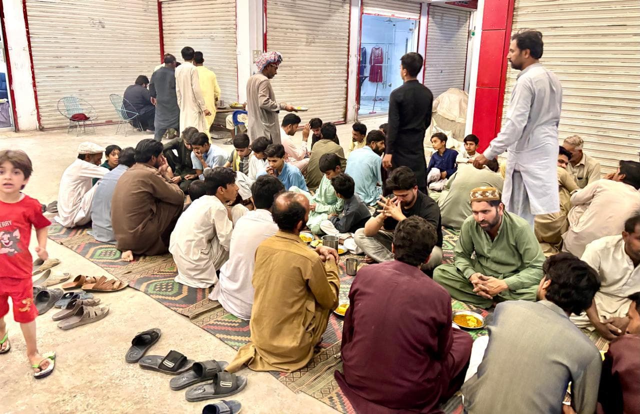 Community members seated for Ramadan iftaar in Burewala